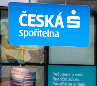 Feature image of Česká spořitelna's logo on the exterior of a modern building facade, symbolizing the bank's strong presence in the Czech financial sector.